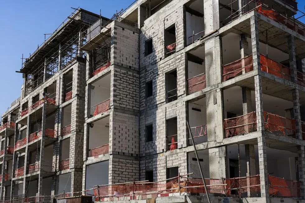 Multistory block-and-concrete building shell under construction
