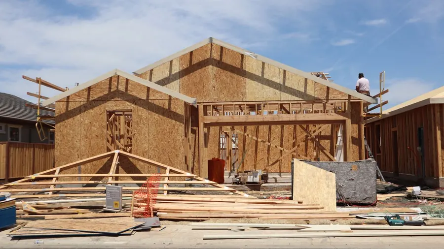 Wood-framed home with sheathing in progress
